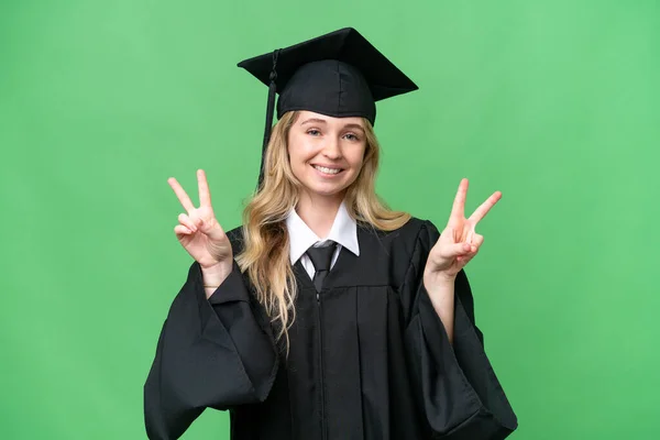 Junge Englische Universitätsabsolventin Mit Isoliertem Hintergrund Zeigt Mit Beiden Händen — Stockfoto