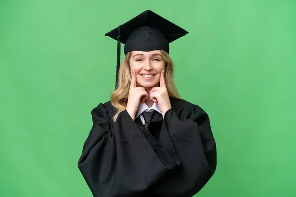 Joven Universitaria Inglesa Graduada Sobre Fondo Aislado Sonriendo Con Una — Foto de Stock