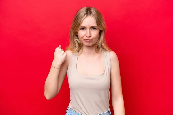 stock image Young English woman isolated on red background with unhappy expression