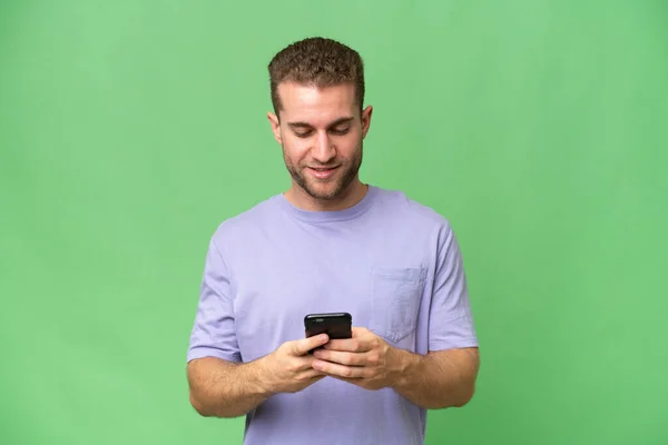 Young Handsome Caucasian Man Isolated Green Chroma Background Sending Message — Stock Photo, Image