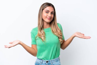 Young Uruguayan woman isolated on white background having doubts