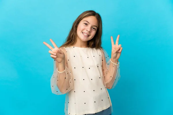 Little Girl Isolated Blue Background Showing Victory Sign Both Hands — 스톡 사진