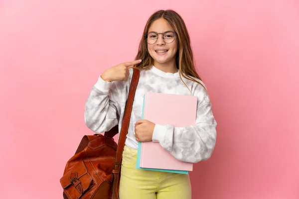 stock image Student little girl over isolated pink background giving a thumbs up gesture