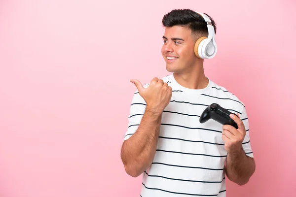 Young Handsome Man Playing Video Game Controller Isolated Pink Background — Stockfoto