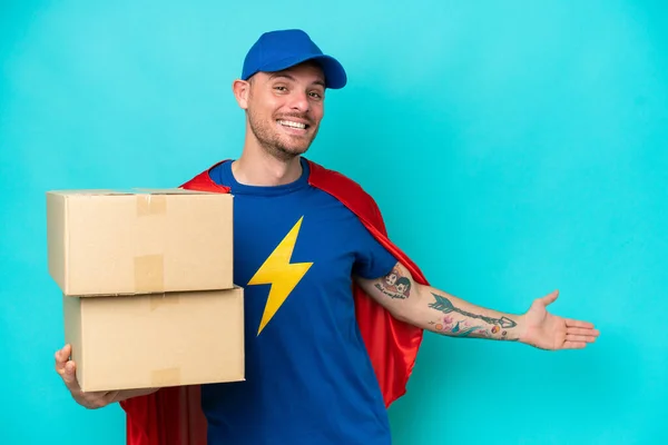 Super Hero Delivery Man Isolated Background Extending Hands Side Inviting — Stock Photo, Image
