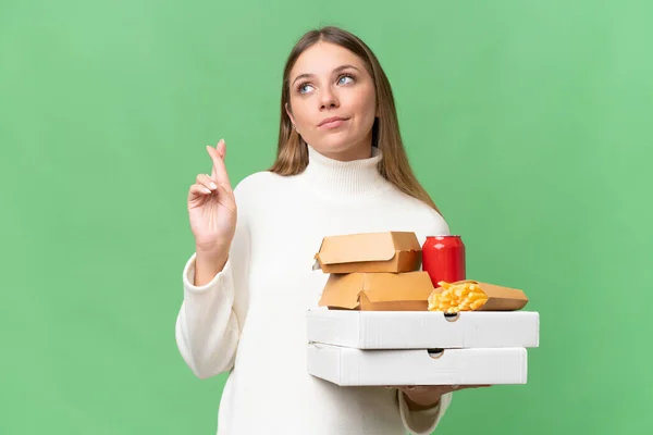 Young Beautiful Blonde Woman Holding Takeaway Food Isolated Background Fingers — Stock Photo, Image