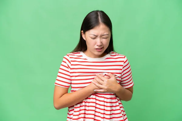 stock image Young Asian woman over isolated background having doubts