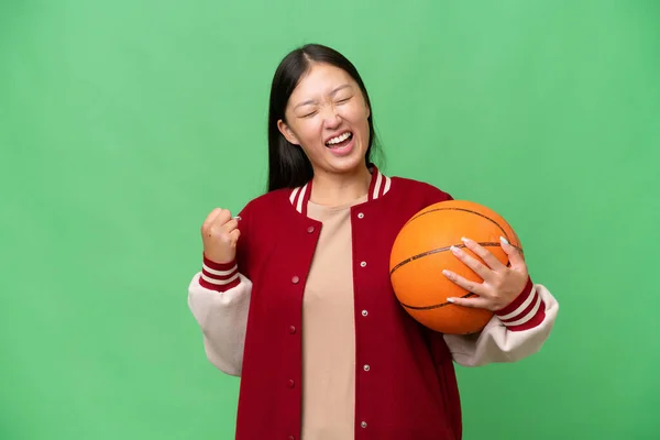 Young Basketball Player Asian Woman Isolated Background Celebrating Victory — 스톡 사진