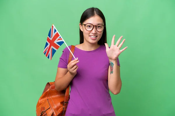 Junge Asiatin Mit Britischer Flagge Vor Isoliertem Hintergrund Die Mit — Stockfoto