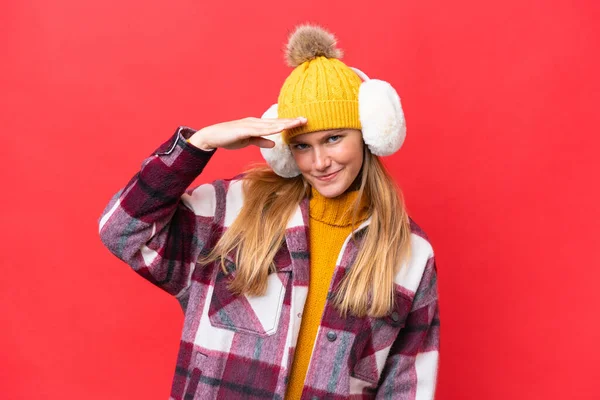 Young Beautiful Woman Wearing Winter Muffs Isolated Red Background Looking — Stock Photo, Image