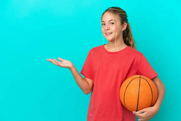 Little Caucasian Girl Playing Basketball Isolated Blue Background Extending Hands — Stock Photo, Image