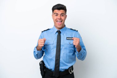 Young police caucasian man isolated on white background celebrating a victory in winner position