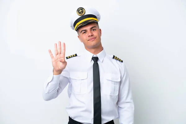 飞机驾驶员高加索人男子在白色背景上孤独快乐 用手指数着四个 — 图库照片