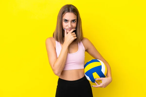Young Woman Playing Volleyball Isolated Yellow Background Thinking — Stok fotoğraf