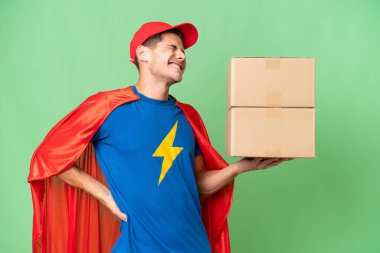 Super Hero delivery man over isolated background suffering from backache for having made an effort