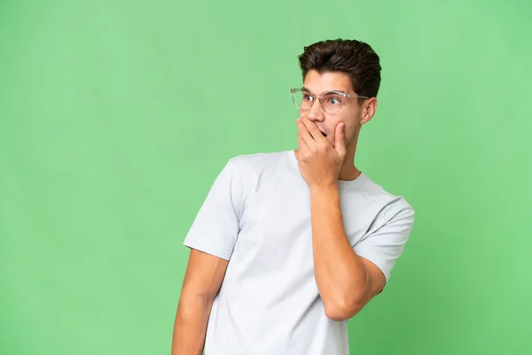 Young Caucasian Handsome Man Isolated Background Doing Surprise Gesture While — Stock Photo, Image