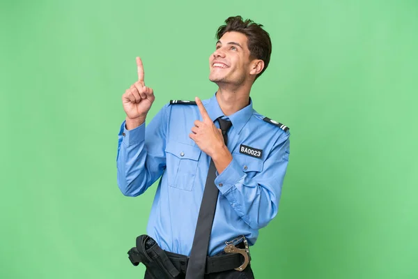 Νεαρός Αστυνομικός Πάνω Από Απομονωμένο Υπόβαθρο Που Δείχνει Δείκτη Μια — Φωτογραφία Αρχείου