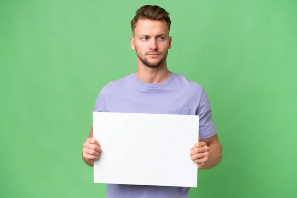 Young Blonde Caucasian Man Isolated Background Holding Empty Placard — Stock Photo, Image