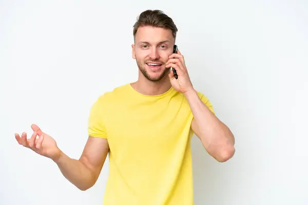 Young Blonde Caucasian Man Isolated White Background Keeping Conversation Mobile — Stock Photo, Image
