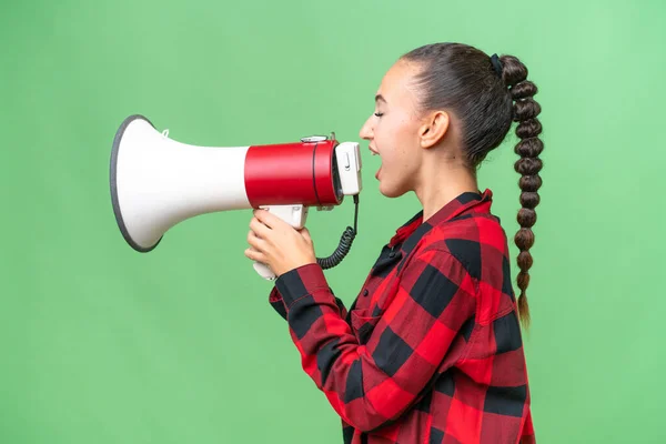 Young Arab Woman Isolated Background Shouting Megaphone Announce Something Lateral — Stock Photo, Image
