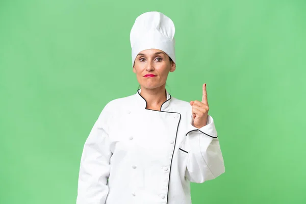 Middle Aged Chef Woman Isolated Background Pointing Index Finger Great — Stock Photo, Image