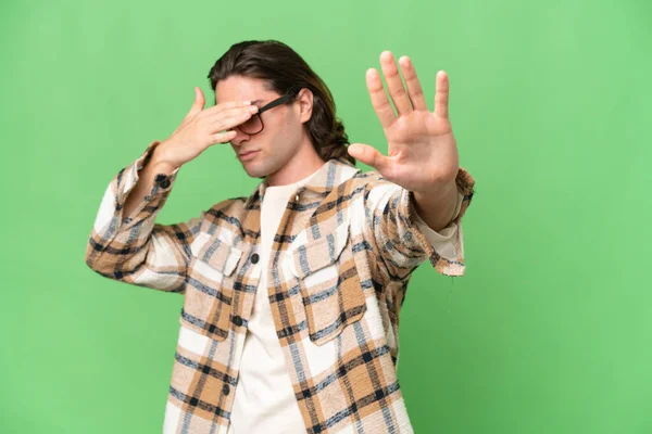 Young Caucasian Man Isolated Green Chroma Background Making Stop Gesture — Stock Photo, Image