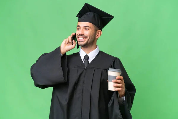 Junger Universitätsabsolvent Über Isolierten Hintergrund Mit Kaffee Zum Mitnehmen Und — Stockfoto