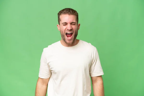 Young Handsome Caucasian Man Isolated Green Chroma Background Shouting Front — Stock Photo, Image