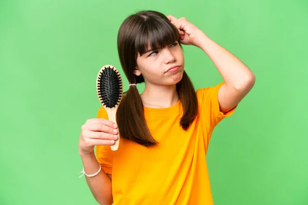 Little Caucasian Girl Hair Comb Isolated Background Having Doubts Confuse — Stock Photo, Image