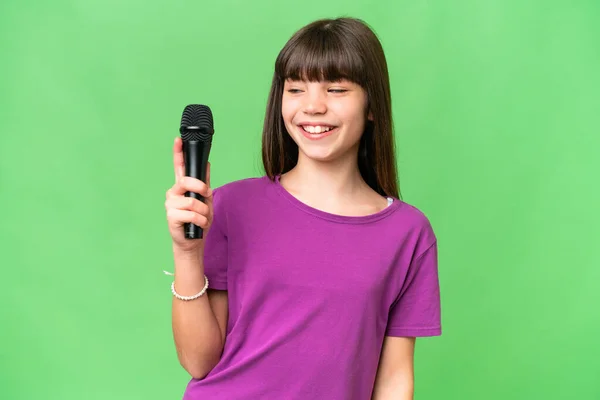 Little Singer Girl Picking Microphone Isolated Background Happy Expression — Stock Photo, Image