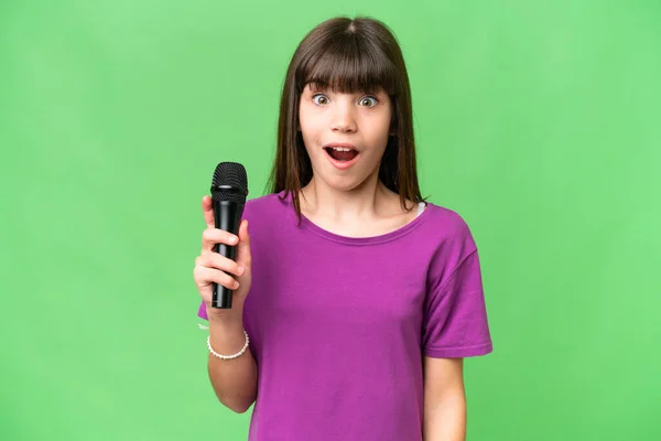 Little Singer Girl Picking Microphone Isolated Background Surprise Shocked Facial — Stock Photo, Image