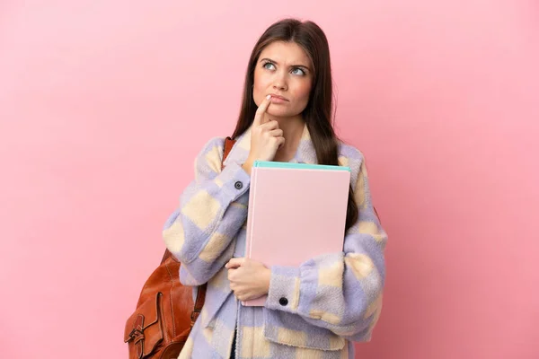 Young Student Woman Isolated Pink Background Having Doubts While Looking — 스톡 사진