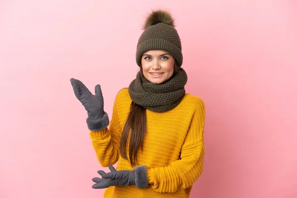 Young Caucasian Girl Winter Hat Isolated Pink Background Extending Hands — Stock Photo, Image