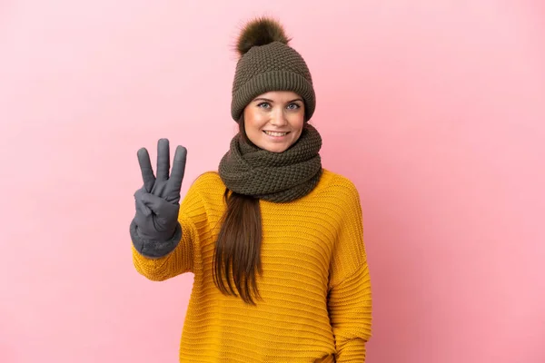 Young Caucasian Girl Winter Hat Isolated Pink Background Happy Counting — Stock Photo, Image