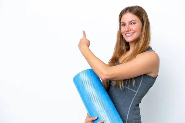 Young Sport Woman Going Yoga Classes While Holding Mat Pointing — 图库照片