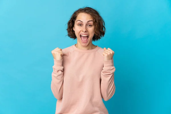 Young English Woman Isolated Blue Background Celebrating Victory Winner Position — Foto Stock