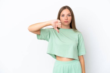 Young Lithuanian woman isolated on white background showing thumb down with negative expression