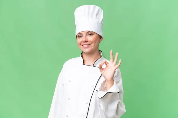 Jonge Chef Kok Vrouw Geïsoleerde Groene Achtergrond — Stockfoto