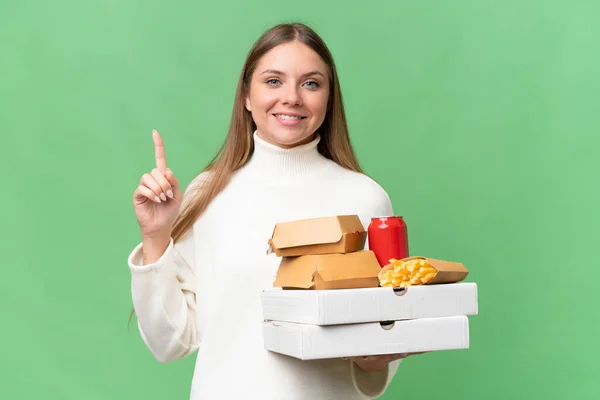 Young Beautiful Blonde Woman Holding Takeaway Food Isolated Background Pointing — Stockfoto