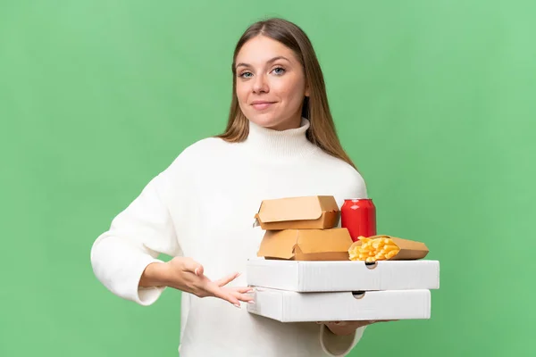 Young Beautiful Blonde Woman Holding Takeaway Food Isolated Background Extending — Stock Photo, Image