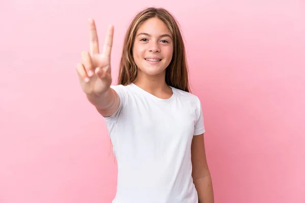 Little Caucasian Girl Isolated Pink Background Smiling Showing Victory Sign — Stock Fotó
