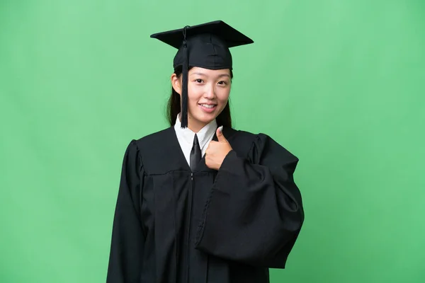 Young University Graduate Asian Woman Isolated Background Giving Thumbs Gesture — Stok fotoğraf
