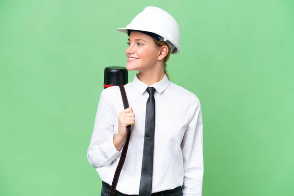 Young Architect Caucasian Woman Helmet Holding Blueprints Isolated Background Looking — Stockfoto