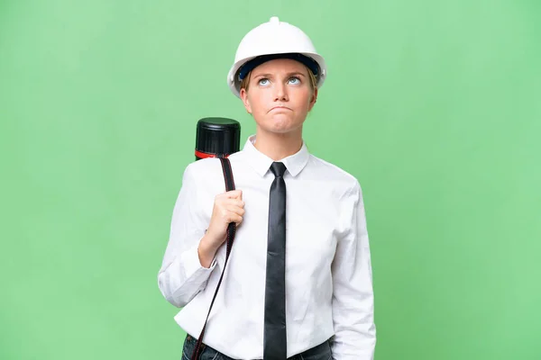 Young Architect Caucasian Woman Helmet Holding Blueprints Isolated Background Looking — Stock Photo, Image