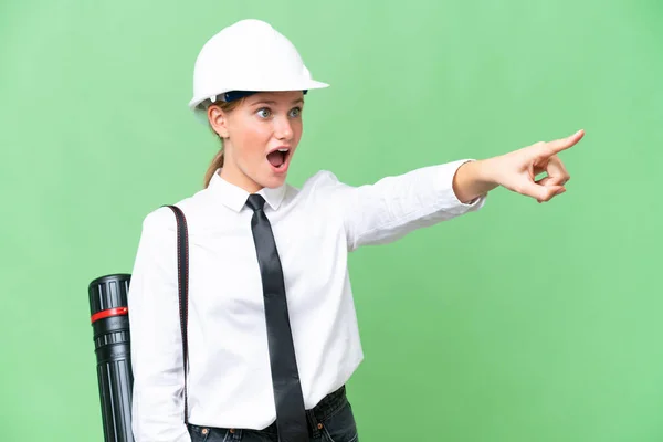 Young Architect Caucasian Woman Helmet Holding Blueprints Isolated Background Pointing — Stock Photo, Image