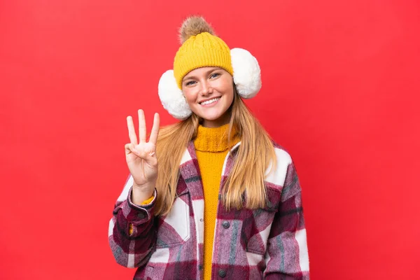 Young Beautiful Woman Wearing Winter Muffs Isolated Red Background Happy — Stock Photo, Image