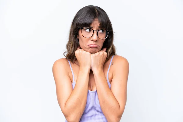 stock image Young caucasian woman over isolated background With glasses and tired