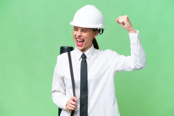 Joven Arquitecta Con Casco Planos Sobre Fondo Aislado Celebrando Una —  Fotos de Stock