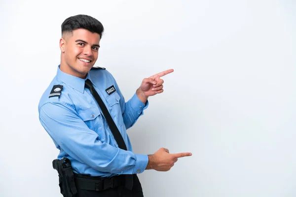Молодий Поліцейський Кавказький Чоловік Ізольований Білому Тлі Вказуючи Пальцем Бік — стокове фото