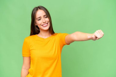 Young pretty caucasian woman over isolated background giving a thumbs up gesture